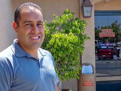 Antonio Solorio poses at the entrance of Tacos Uruapan.